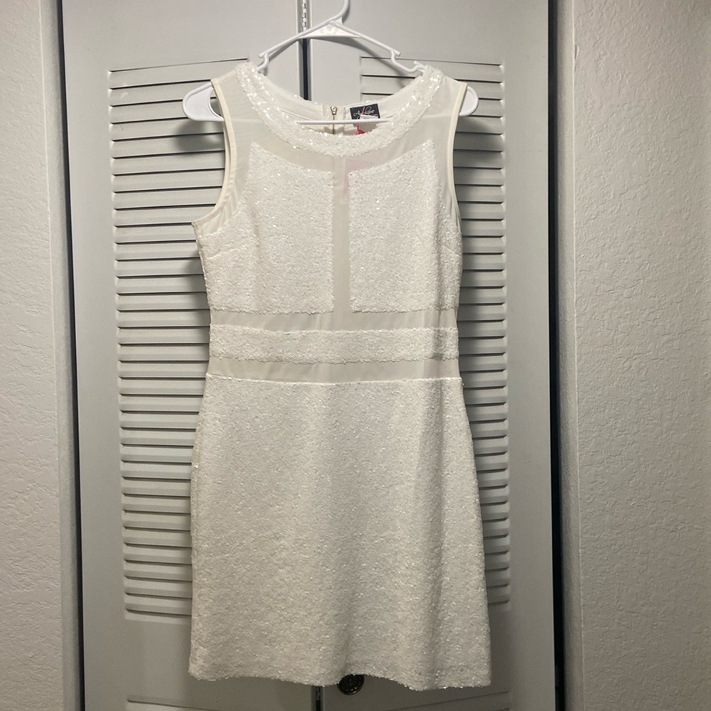 Short white dress brand new. Never used.